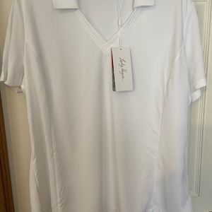 Ladies white golf shirt with v-collared neckline.